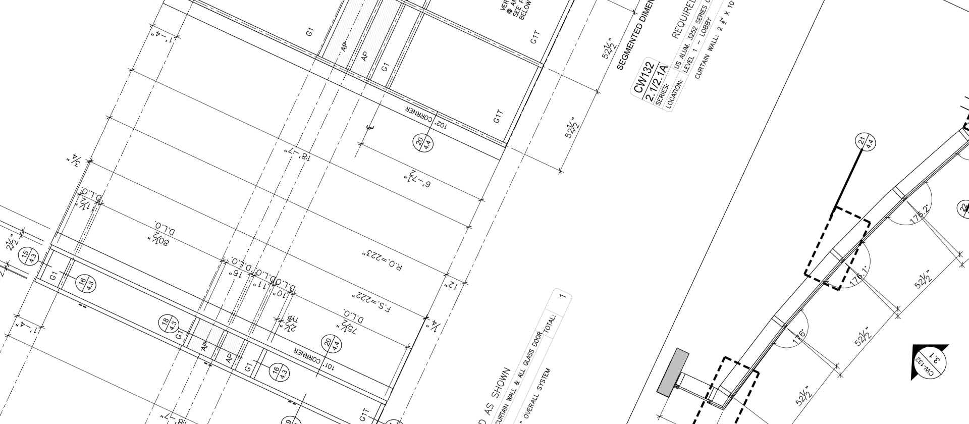 A close-up of architectural blueprints showing structural details, measurements, symbols, and technical notes on a white background, oriented at an angle.